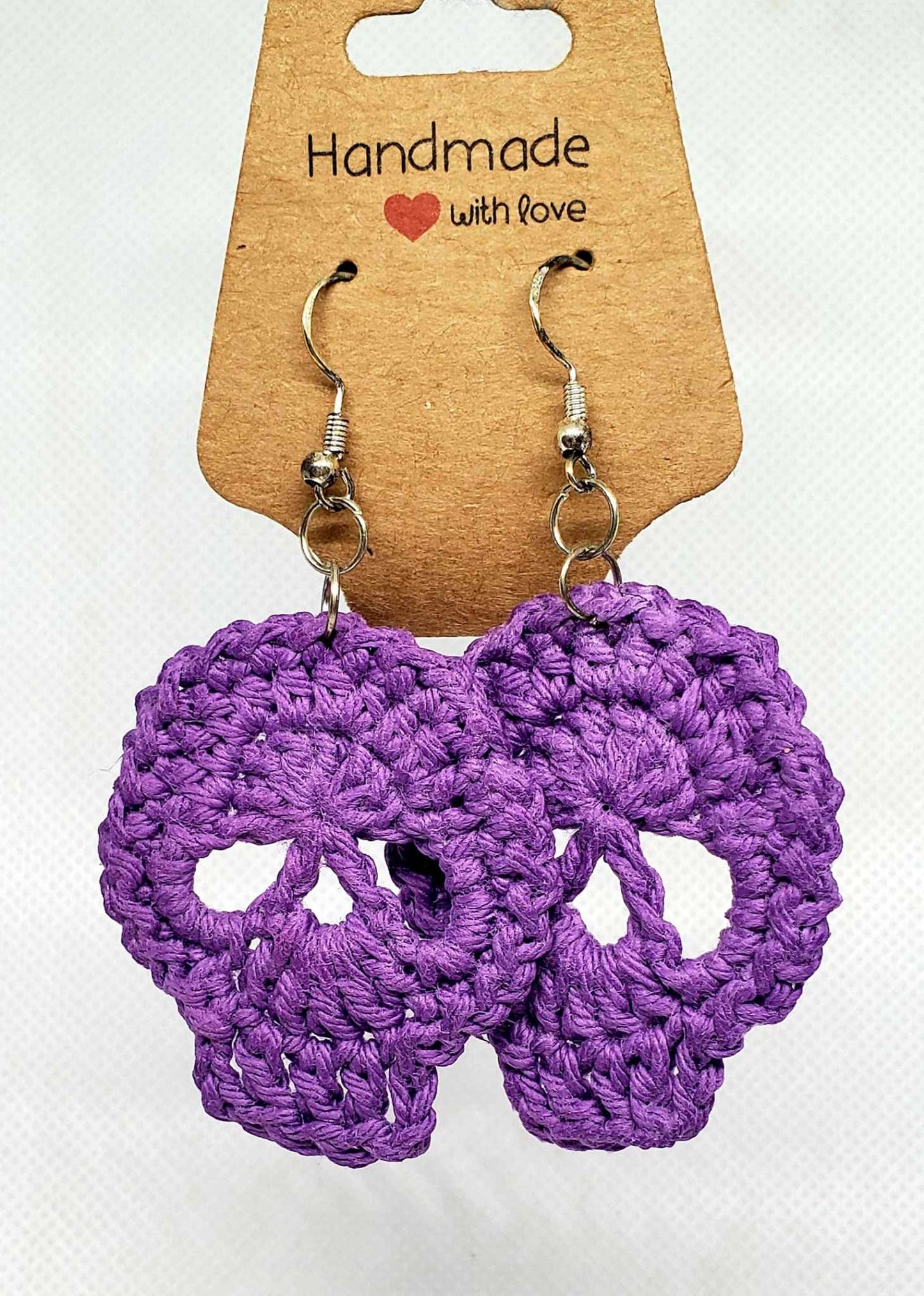Large purple skull earrings